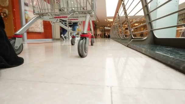 Shopping Cart Hypermarket Low Angle Shot Focused Wheel Shopping Trolley — Stockvideo