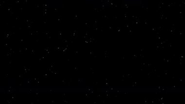 Yüzen toz parçacıkları havada veya suda hareket ediyor. Siyah arka grond 'da izole edilmiş döngüsel animasyon