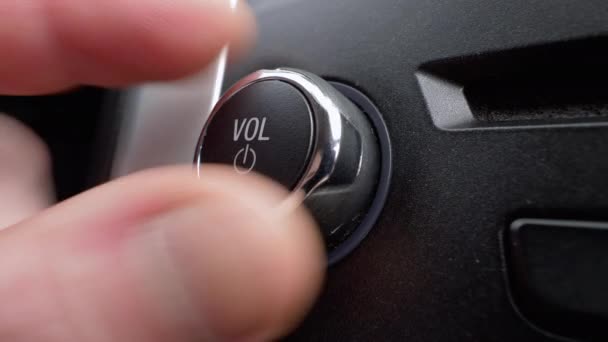 Car Dashboard Volume Knob Drivers Hand Adjusts Volume Control Car — стоковое видео