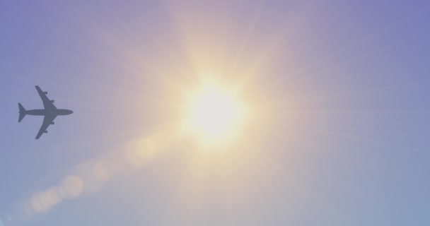 Airplane Flying Sky Silhouette Passenger Airliner Flying Overhead Bright Sun — Stock Video