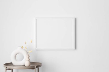 Duvarda lagurus süslemeli beyaz çerçeve..