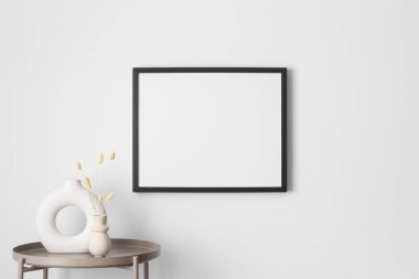 Duvarda lagurus desenli siyah çerçeve..