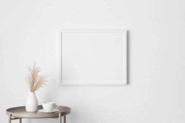 White frame mockup on the wall with a pampas decoration.