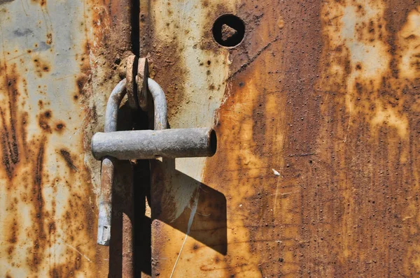 rusty metal door old broken padlock lock