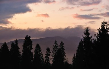 Sunset behind the Bieszczady Mountains the light of the setting sun Poland