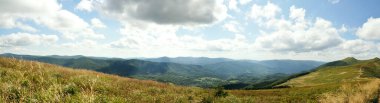 Panoramic picture of Bieszczady mountains, Bieszczady National Park, empty road leading towards mountain peaks beauty in nature