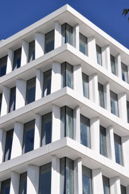 modern white building exterior symetric windows in a row modern architecture in Warsaw Poland