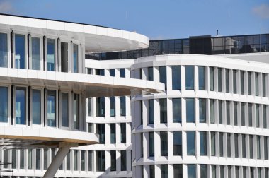 modern white building exterior symetric windows in a row modern architecture in Warsaw Poland