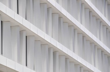 modern white building exterior symetric windows in a row modern architecture in Warsaw Poland