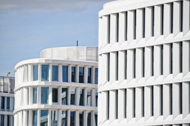 modern white building exterior symetric windows in a row modern architecture in Warsaw Poland