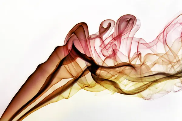 stock image Colorful smoke swirls and twists on a white background