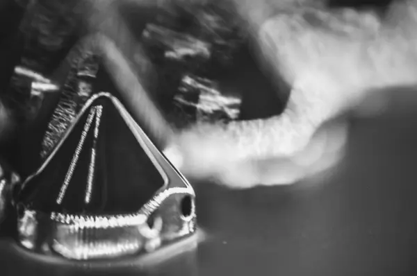 Stock image Close-up macro of sewing studs arranged in symmetrical rows in black and white abstraction