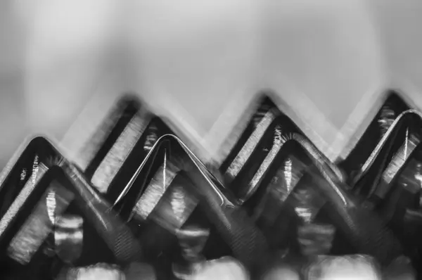 stock image Close-up macro of sewing studs arranged in symmetrical rows in black and white abstraction