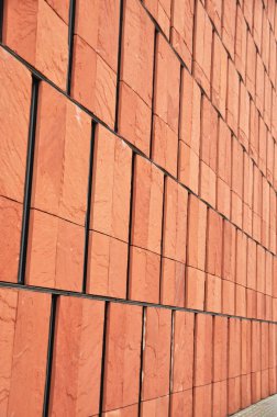 Red brick facade with narrow windows of a modern building, modern architecture clipart