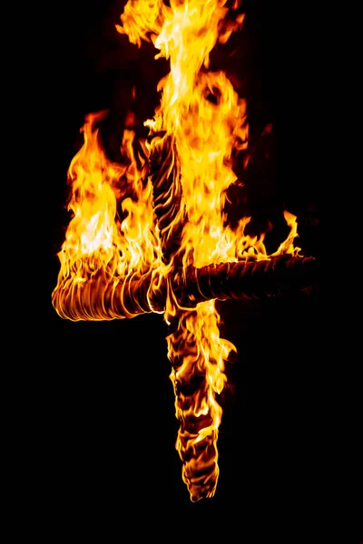 A burning cross at Lewes bonfire night representing one of the Protestant martyrs who was burnt at the stake in the town in the 16th century