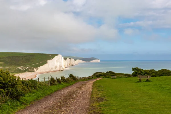 stock image Looking along a pathway leading to the coast and the Seven SIsters cliffs, on a sunny spring day