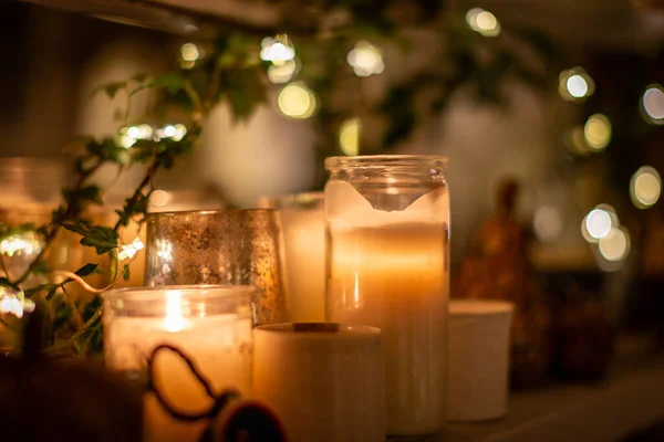 Decorative candles in jars, with a shallow depth of field