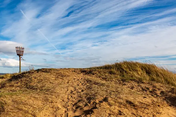 A fire beacon in the sand dunes at Skegness, on a sunny winter\'s day