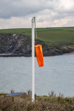 A close up of a wind sock on Burgh island in Devon clipart