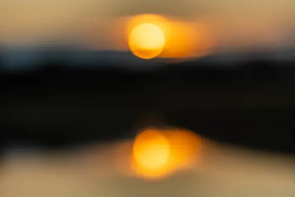 stock image Sunset over a River, with intentional blur