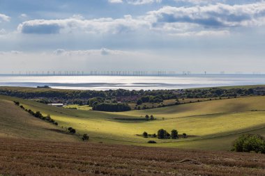 A rolling South Downs landscape with the sea behind, near Rottingdean in Sussex clipart