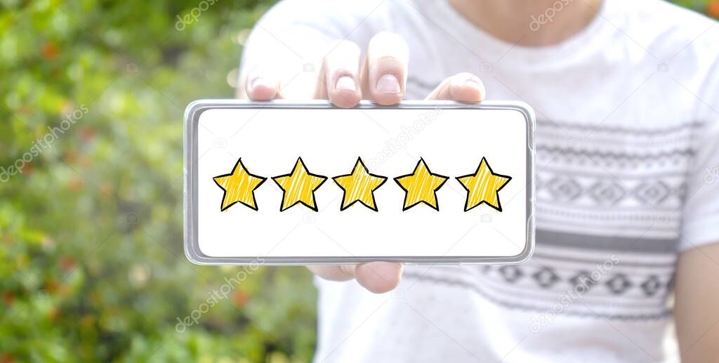 Five star cartoon sketch style on screen smartphone with blurred background. Service rating, satisfaction concept. reviews and comment google maps. online feedback