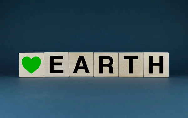 Earth. The cubes form the words Love Earth. The concept of respect for the earth and love for it, Save the planet