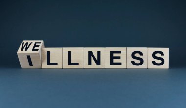 Ahşap bloklarda sağIık ve hastalık kelimelerini içeren kavramsal bir görüntü. Bu görsel tasvir bir sağlık durumu ile bir hastalık durumu arasındaki zıtlığı vurgular ve yaptığımız seçimleri sembolize etmek için kullanılabilir.