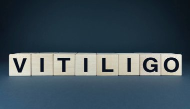 Tahta bloklar VITILIGO insan derisinin çeşitliliğini ve bireyselliğini sembolize eder. Makaleleri, blog yazılarını veya vücut pozitifliği ve kendini kabulle ilgili herhangi bir projeyi resmetmek için ideal