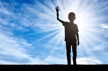 A silhouette of a disabled boy with a prosthetic arm, highlighted by the sun shining in the background. This image symbolizes determination, strength and an unyielding spirit to overcome difficulties for children with prosthetic limbs. clipart