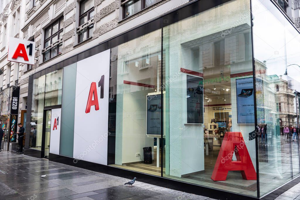 Vienna, Austria - October 14, 2022: Display of a A1 Telekom Austria phone store with people around in Karntner street, a shopping street in Vienna, Austria