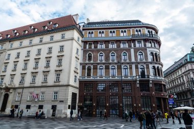Vienna, Austria - October 14, 2022: Facade of classic buildings with people around in Stephansplatz, Innere Stadt, Vienna, Austria