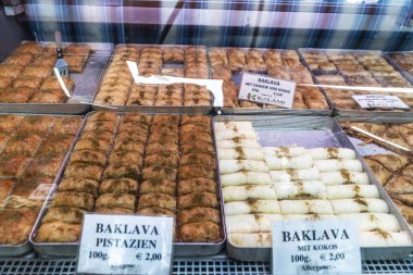 Vienna, Austria - October 14, 2022: Candy shop with pistachio baklava in Naschmarkt, street food market in Vienna, Austria