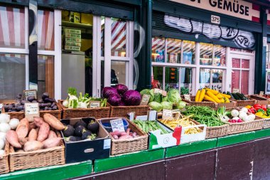 Vienna, Austria - October 14, 2022: Fruit and vegetable shop in Naschmarkt, street food market in Vienna, Austria