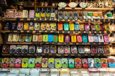 Vienna, Austria - October 14, 2022: Spice and flavor shop with canned sardines and tuna in Naschmarkt, street food market in Vienna, Austria