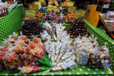Vienna, Austria - October 14, 2022: Display of a nuts and candied fruit shop in Naschmarkt, street food market in Vienna, Austria