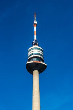 Vienna, Austria - October 17, 2022: Donauturm or Danube Tower, telecommunications tower with a Novomatic advertisement in Donau City or Vienna DC, Vienna, Austria