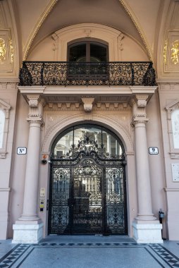 Vienna, Austria - October 17, 2022: Entrance of an old classic building with reliefs in Reichsratsstrabe, Innere Stadt, Vienna, Austria
