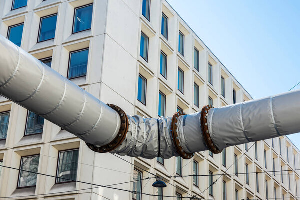 Winding pipe to drain water on a street in Vienna, Austria