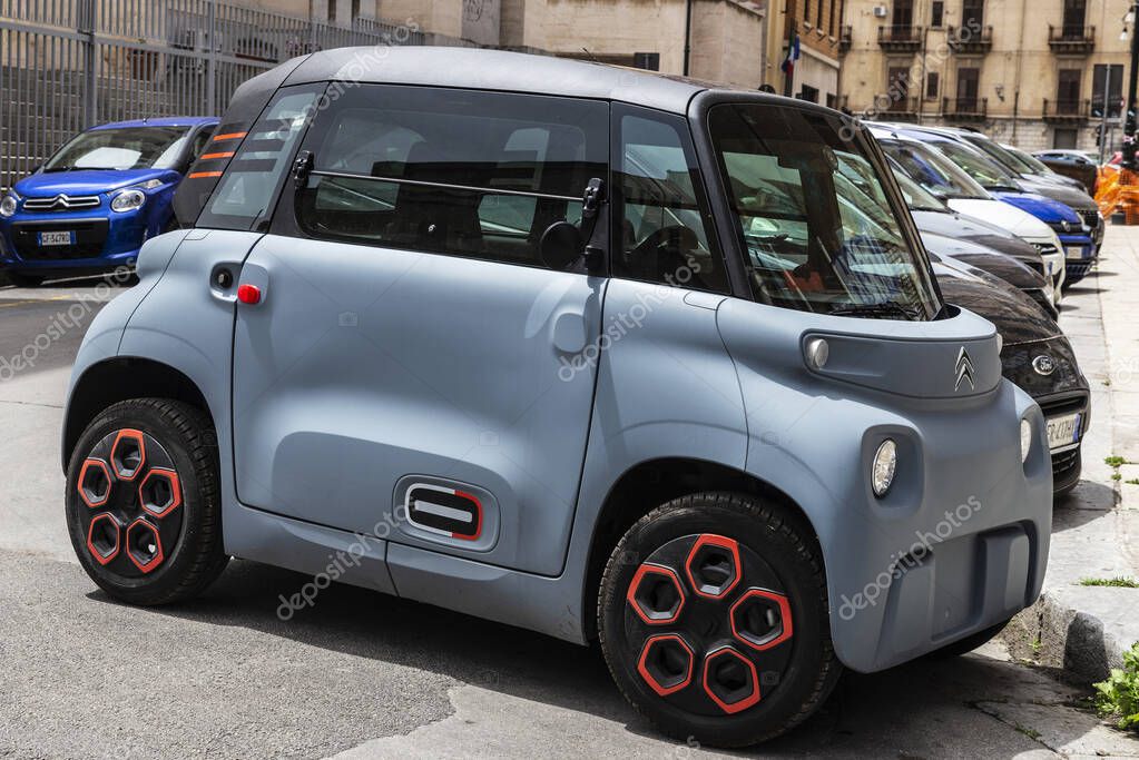 Palermo, Italy - May 13, 2023: Citroen Ami, two-seater small electric vehicle parked on a street in Palermo, Sicily, Italy