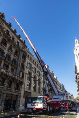Barcelona, Spain - November 19, 2023: Sanjo brand mobile crane on a street in Via Laietana, Barcelona, Catalonia, Spain