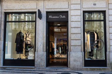 Oporto, Portugal - November 23, 2023: Display of a Massimo Dutti clothing store on a shopping street in Oporto, Portugal clipart