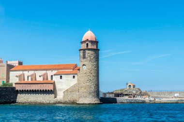 Church of Notre-Dame-des-Anges or Our Lady of the Angels and Saint-Vincent chapel in Collioure or Cotlliure, fishing village of France clipart