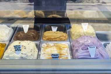 Display of assorted ice creams in a ice cream shop in old town of Collioure or Cotlliure, France clipart