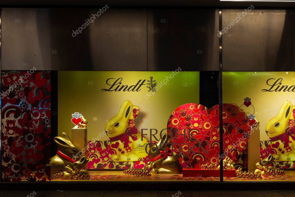 Munich, Germany - April 3, 2025: Display of a Lindt confectionery shop in Kaufingerstrabe, a shopping street of Munich, Germany