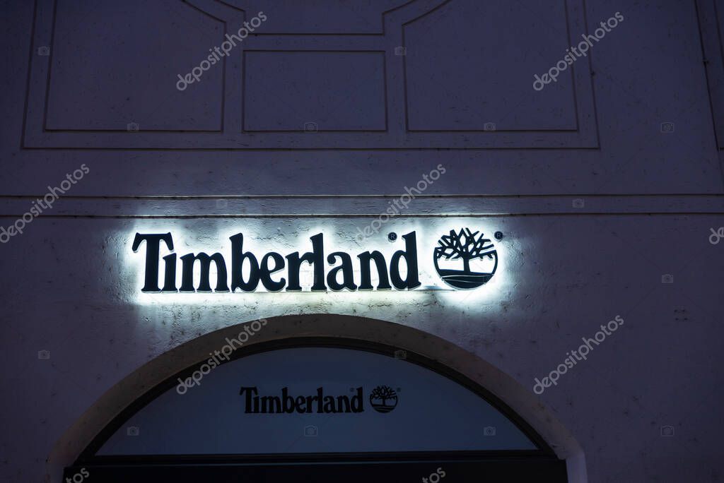 Munich, Germany - April 3, 2025: Sign and logo of a Timberland sportswear or mountain clothing store in Kaufingerstrabe, a shopping street in Munich, Germany