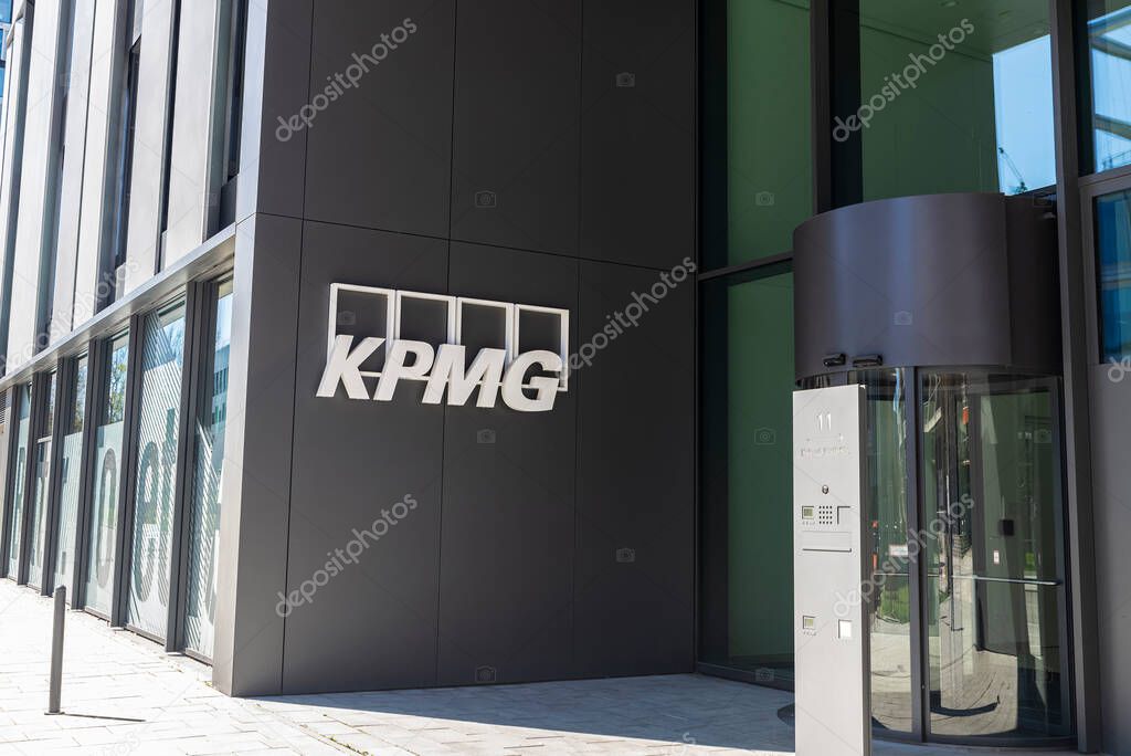 Munich, Germany - April 6, 2025: Facade and sign of the KPMG in Optineo office building in Werksviertel, Munich, Bavaria, Germany
