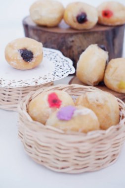 delicious flavor filled ball donuts as a background