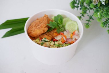 rice with chicken and vegetables in a cup