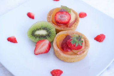 cake with delicious strawberry and kiwi